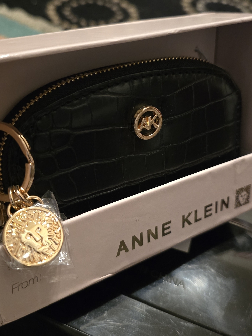 Anne Klein Black Croc-Embossed curved card case with Gold charm